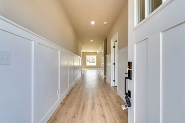 a view of gallery with wooden floor