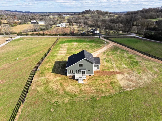 a swimming pool with trees in front of it