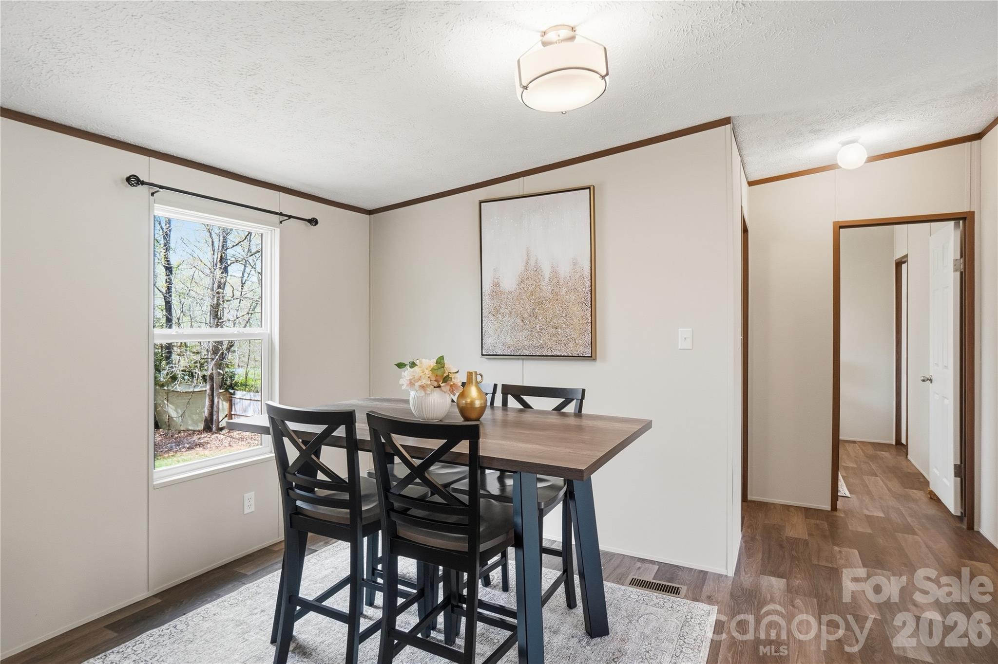 6094 Burnhurst Lane Denver, NC 28037 - Photo 12 of 42 a view of a dining room with furniture and a window