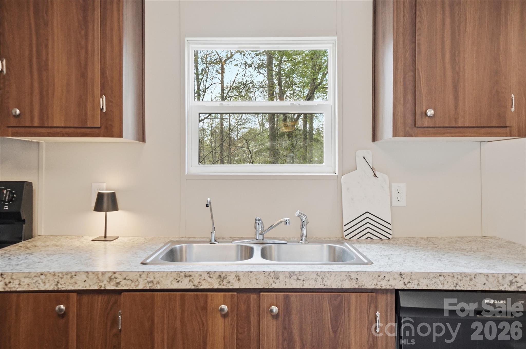 6094 Burnhurst Lane Denver, NC 28037 - Photo 15 of 42 a kitchen with granite countertop stainless steel appliances a sink window and cabinets