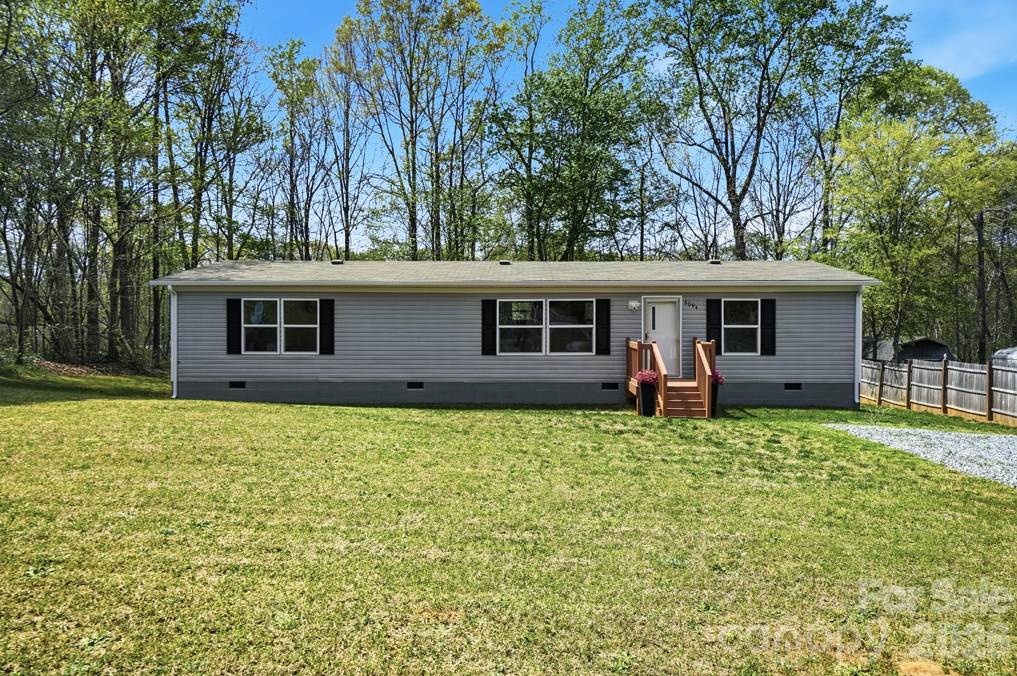 6094 Burnhurst Lane Denver, NC 28037 - Photo 2 of 42 a backyard of a house with seating space