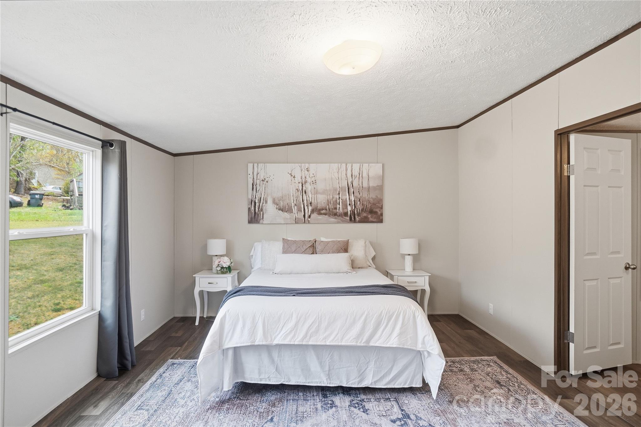 6094 Burnhurst Lane Denver, NC 28037 - Photo 21 of 42 a bedroom with a large bed and a window