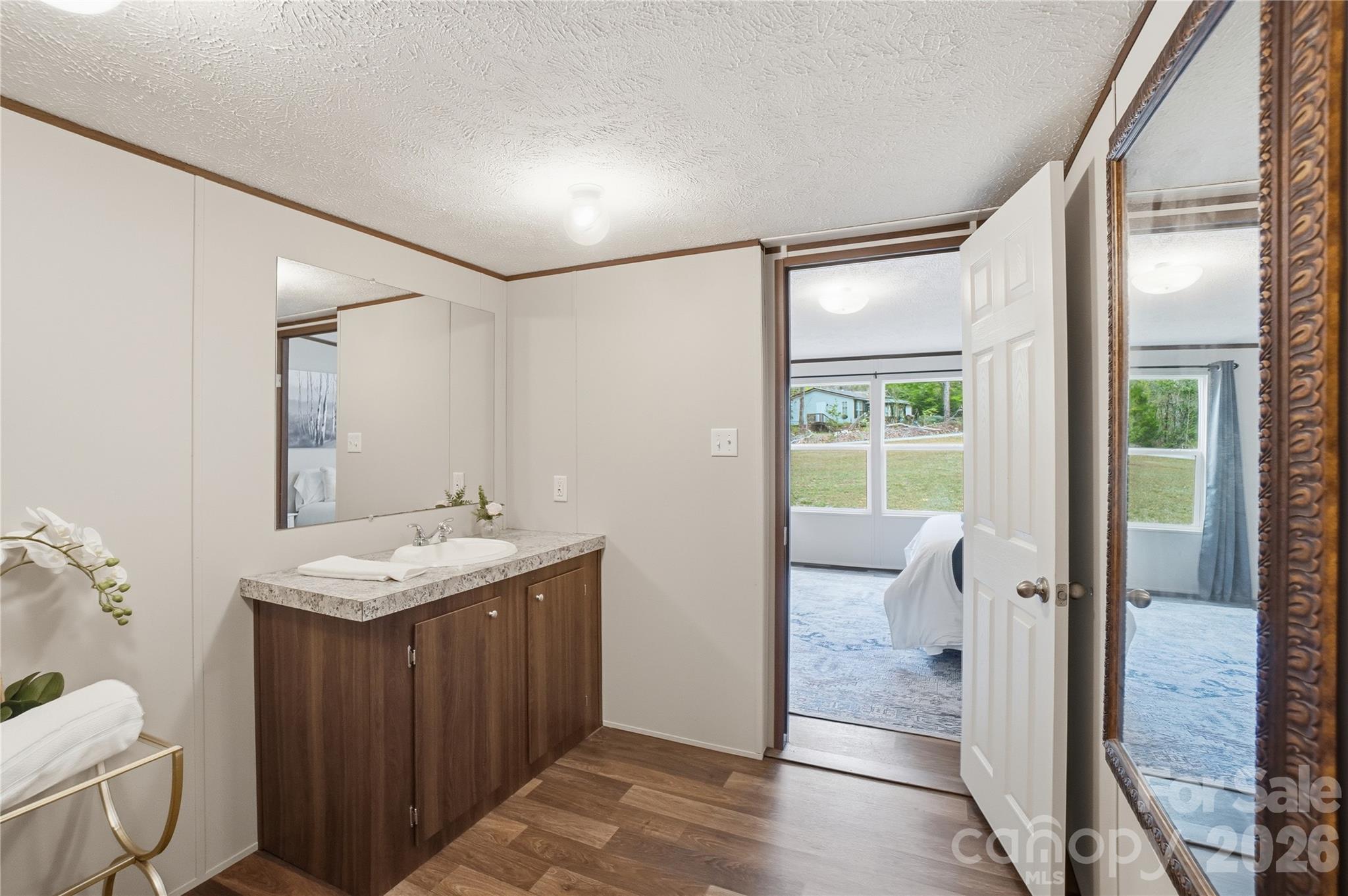 6094 Burnhurst Lane Denver, NC 28037 - Photo 24 of 42 a bathroom with a granite countertop sink a toilet and shower