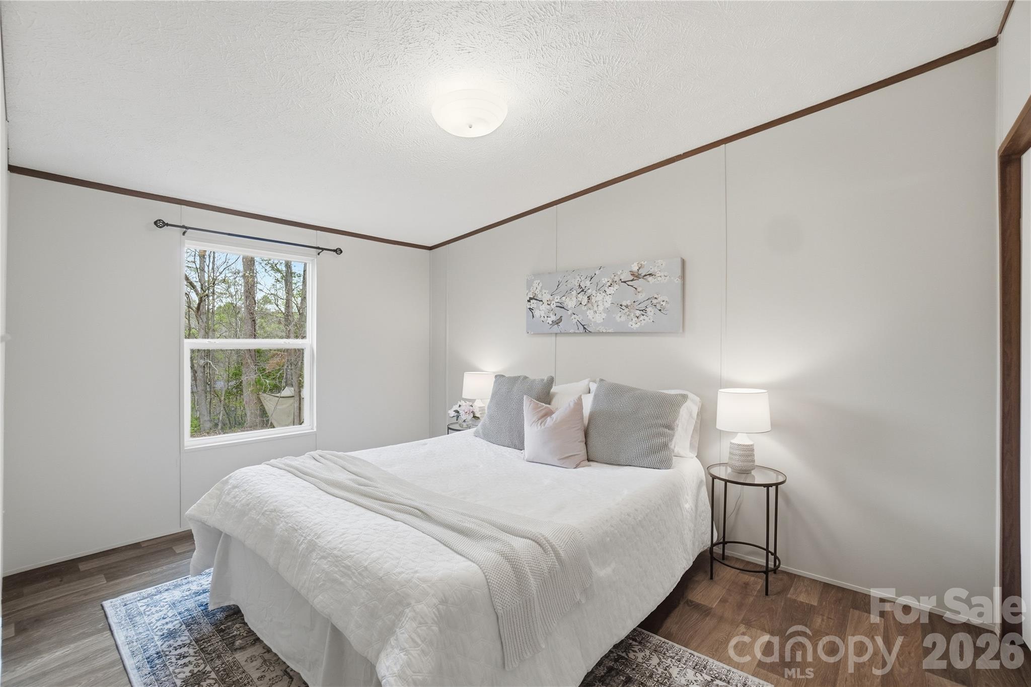 6094 Burnhurst Lane Denver, NC 28037 - Photo 27 of 42 a bedroom with a large bed and a window