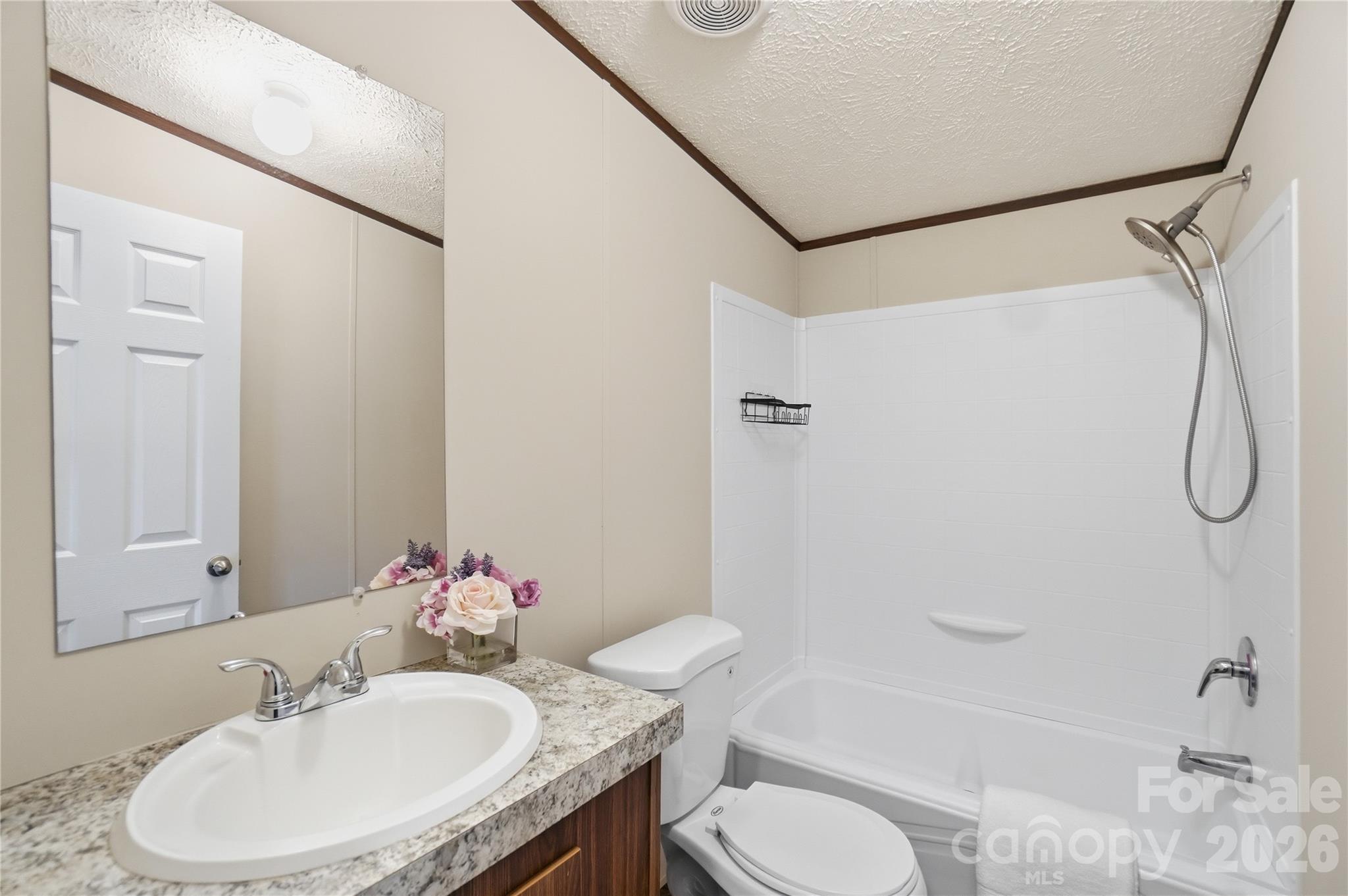 6094 Burnhurst Lane Denver, NC 28037 - Photo 30 of 42 a bathroom with a sink toilet and shower