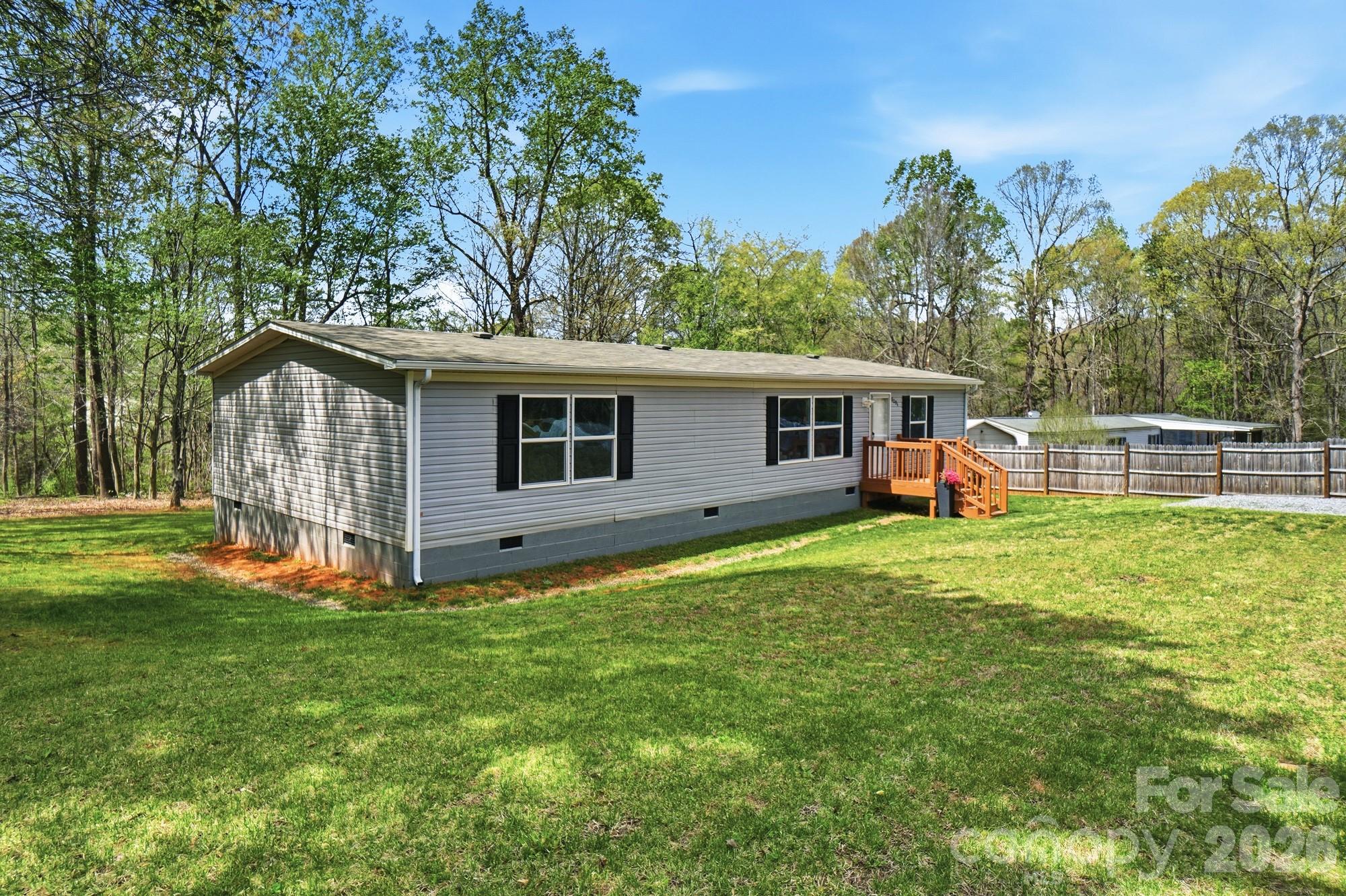 6094 Burnhurst Lane Denver, NC 28037 - Photo 42 of 42 a view of a house with a backyard