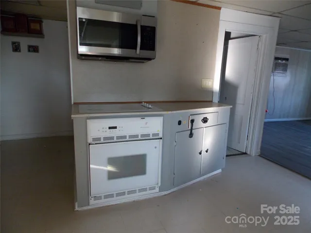 a view of a kitchen with washer and dryer