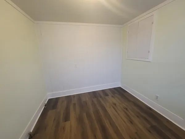 a kitchen with a stove a sink and a refrigerator