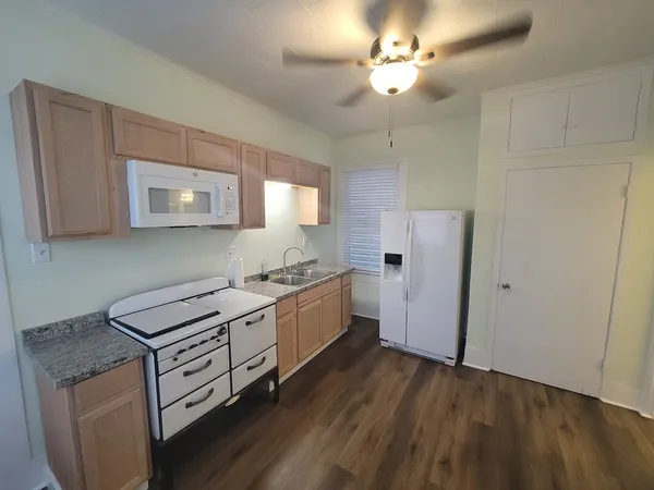 a kitchen with a stove and a sink
