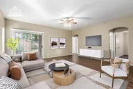 a living room with furniture and a large window