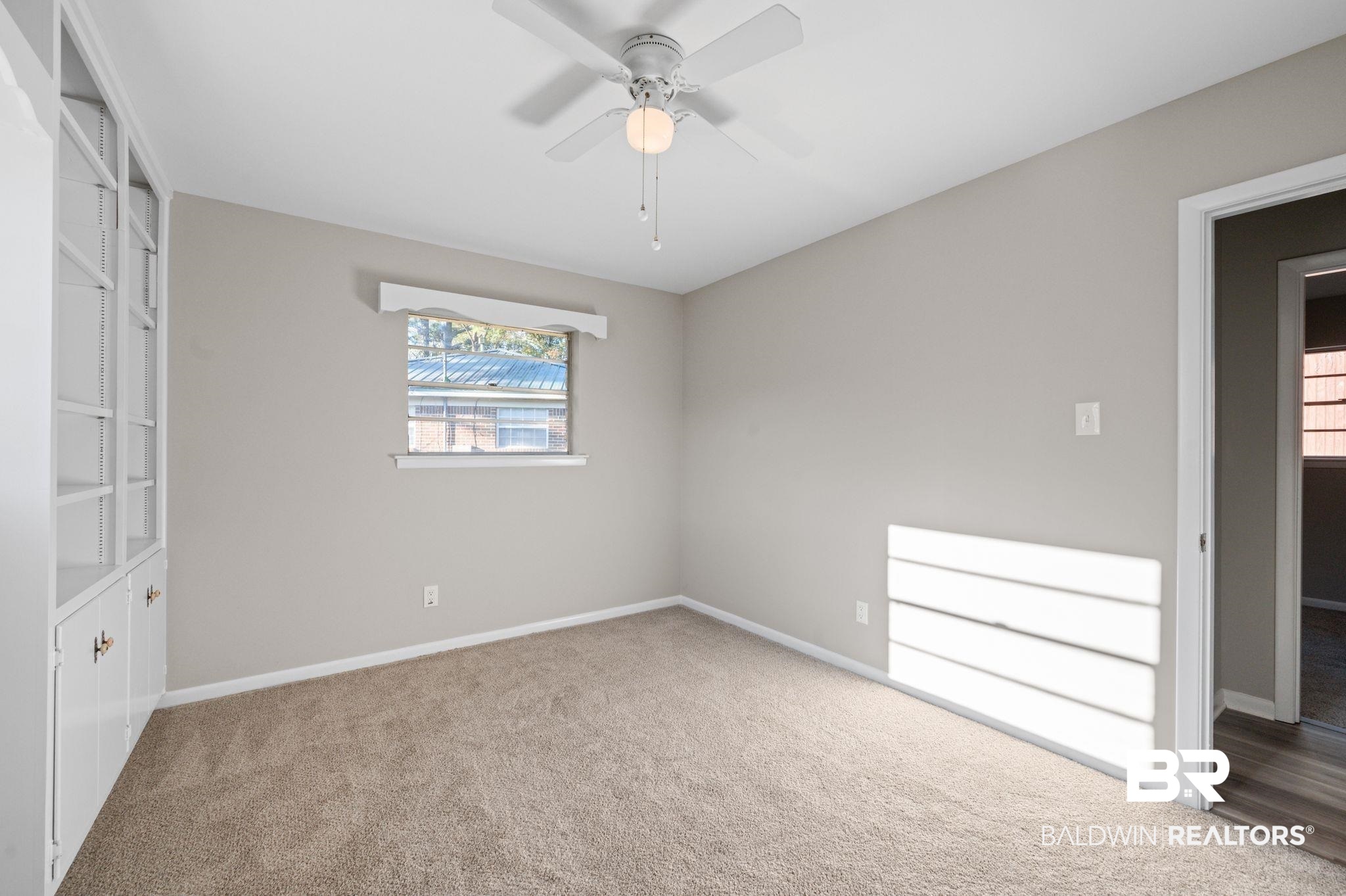909 Caroline Avenue Daphne, AL 36526 - Photo 31 of 46 Unfurnished bedroom with carpet flooring and ceiling fan