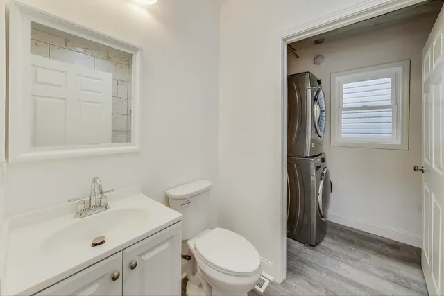 a white toilet sitting next to a bathroom sink