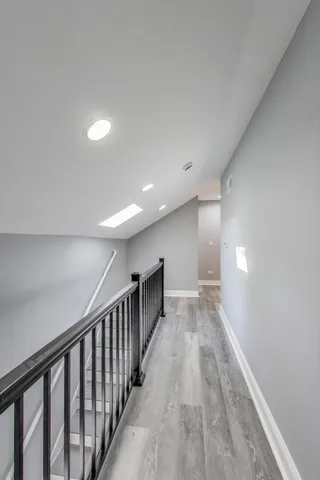 a view of gallery with wooden floor