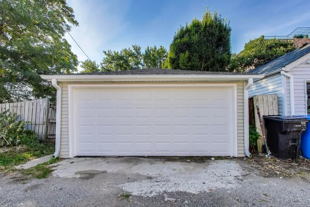a couple of potted plants in front of door