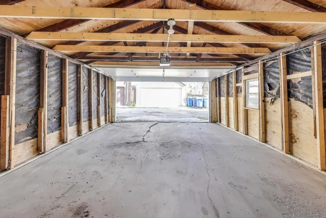 a view of porch with a table and chairs