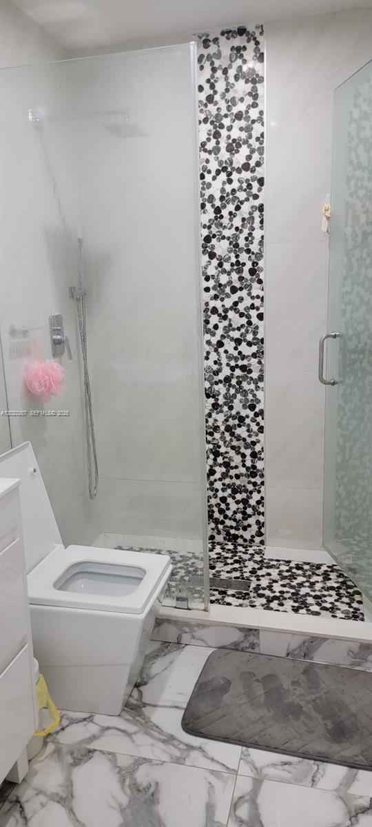 301 Southwest 36th Avenue Miami, FL 33135 - Photo 31 of 32 a bathroom with a toilet and a shower