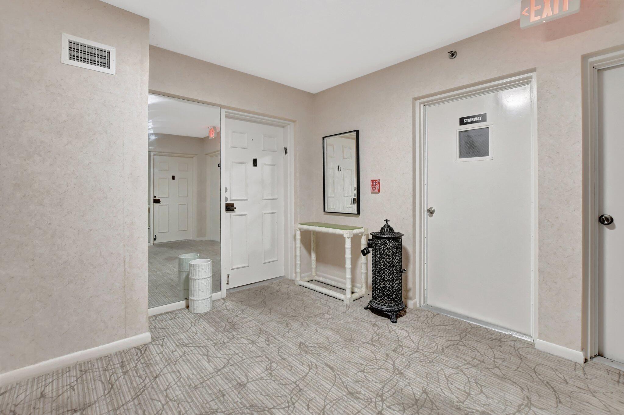 7170 Promenade Drive, Unit 702 Boca Raton, FL 33433 - Photo 45 of 45 hallway entrance