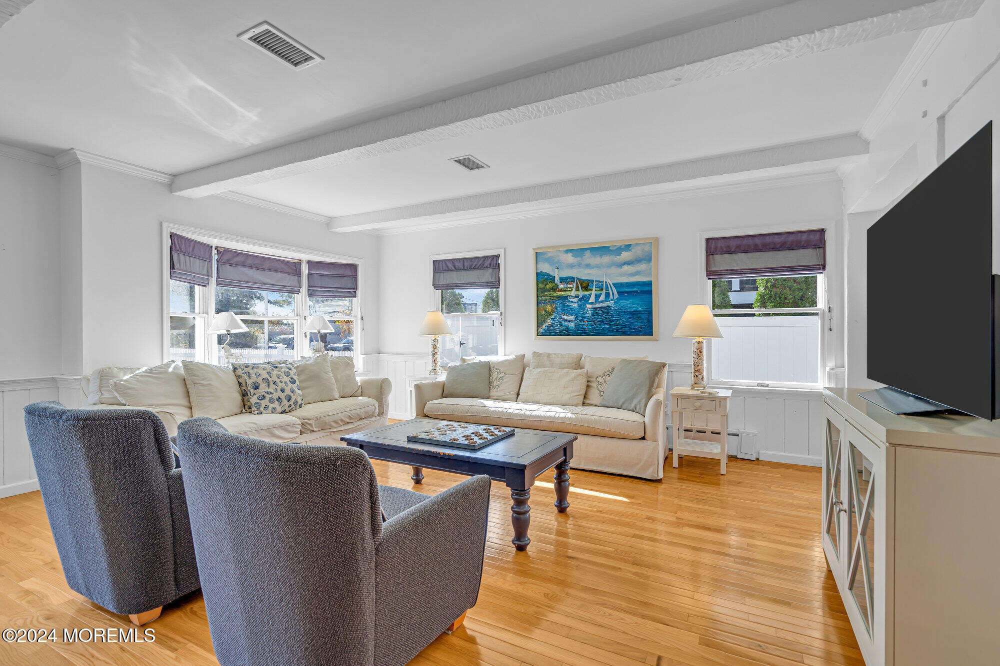 49 Dickman Drive Lavallette, NJ 08735 - Photo 7 of 63 a living room with furniture flat screen tv and window