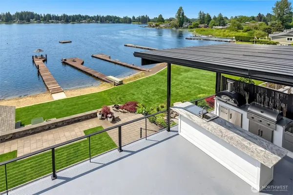 a view of a terrace with a lake view