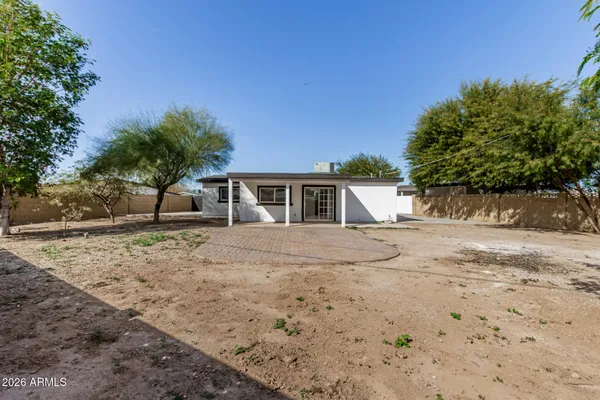 a view of a backyard of the house