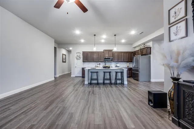 a view of an entryway with wooden floor