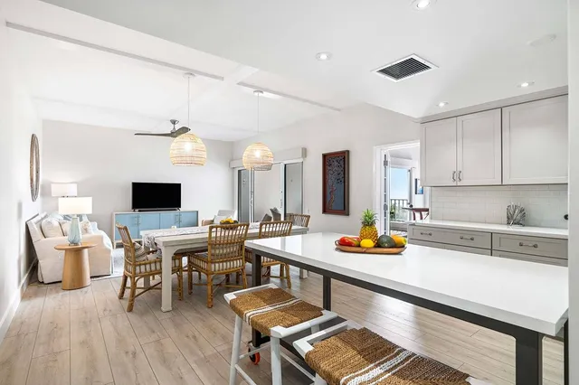 a kitchen with a sink and view living room