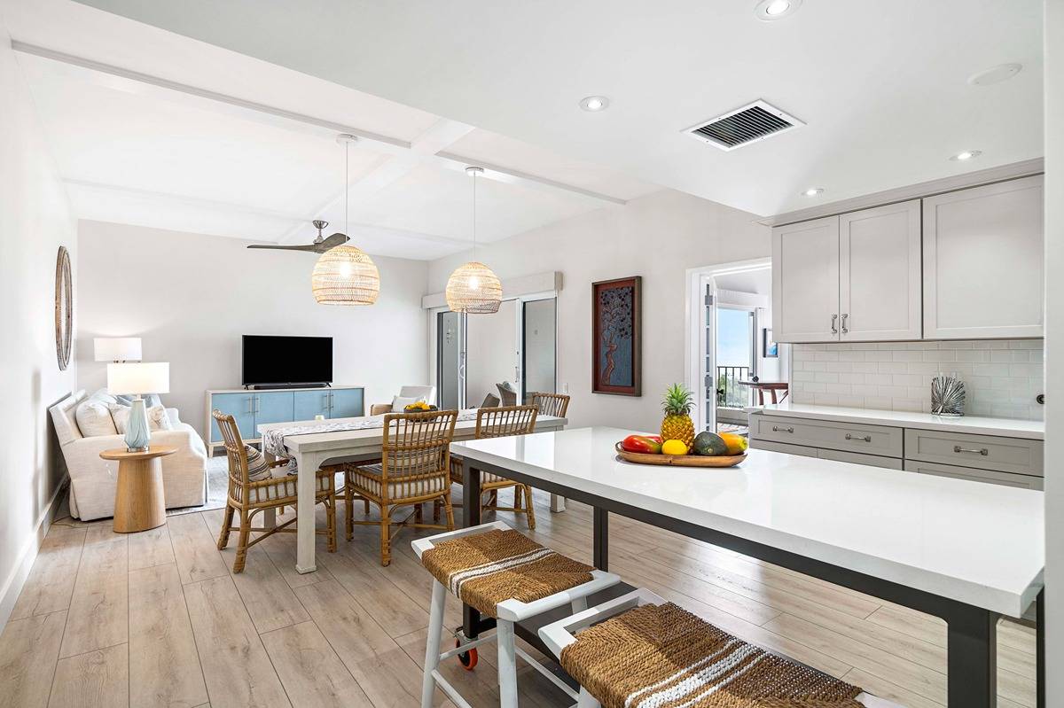 a kitchen with a sink and view living room