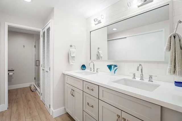 a bathroom with a sink and a mirror