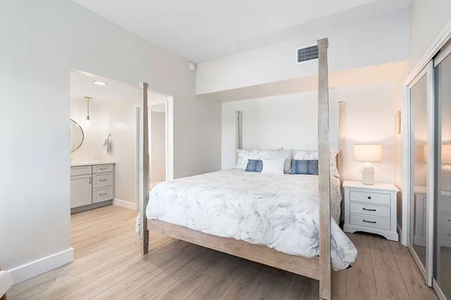 a bedroom with a bed and a cabinets