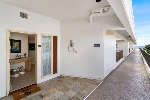 a view of a hallway view with staircase