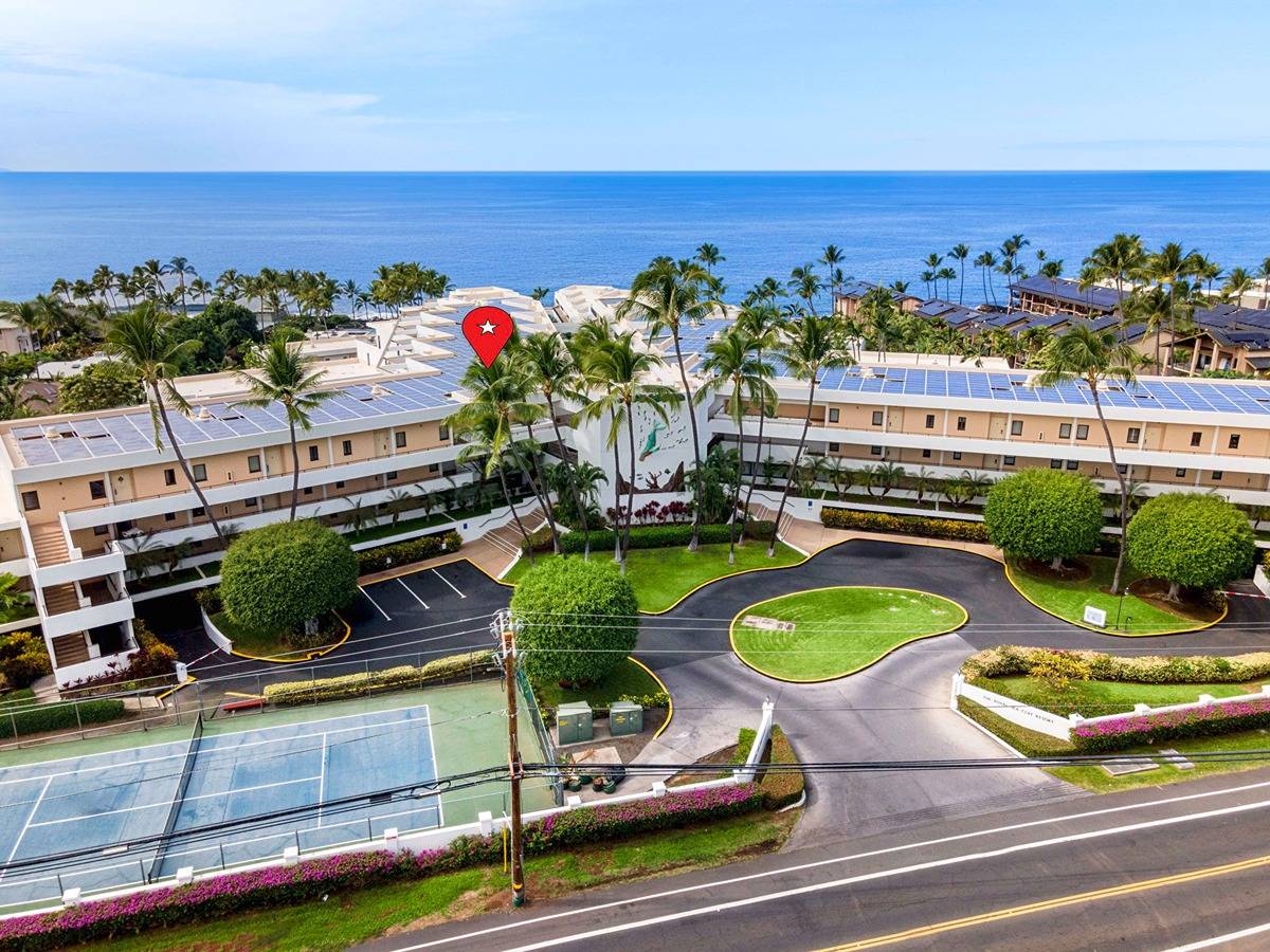 75-6040 Alii Drive, Unit 704 Kailua-Kona, HI 96740 - Photo 5 of 30 a view of a swimming pool with outdoor seating