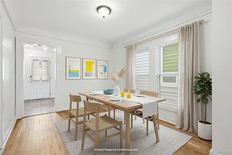 a view of a dining room with furniture window and wooden floor