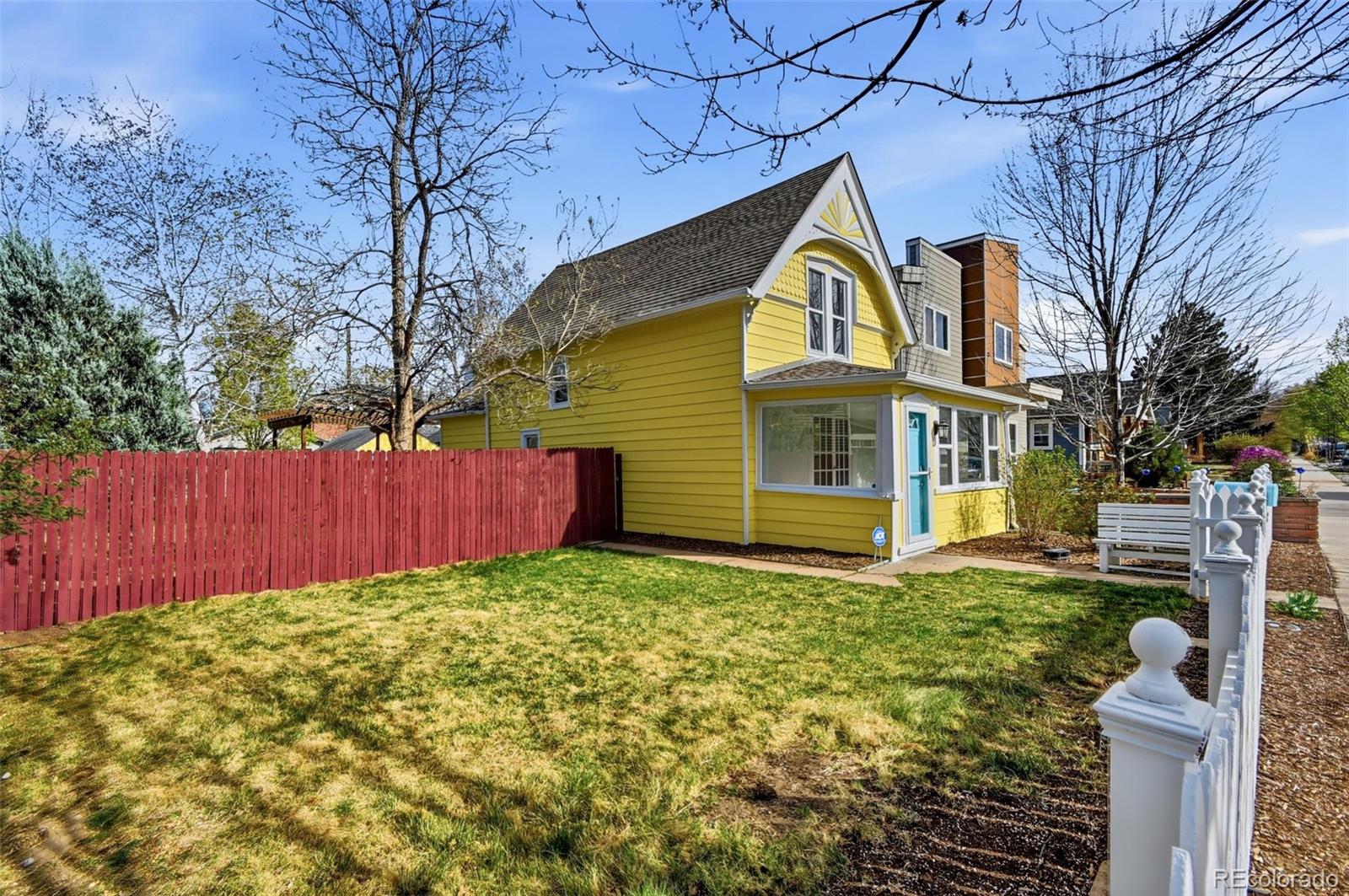 4182 Yates Street Denver, CO 80212 - Photo 2 of 48 a view of a yard in front of house
