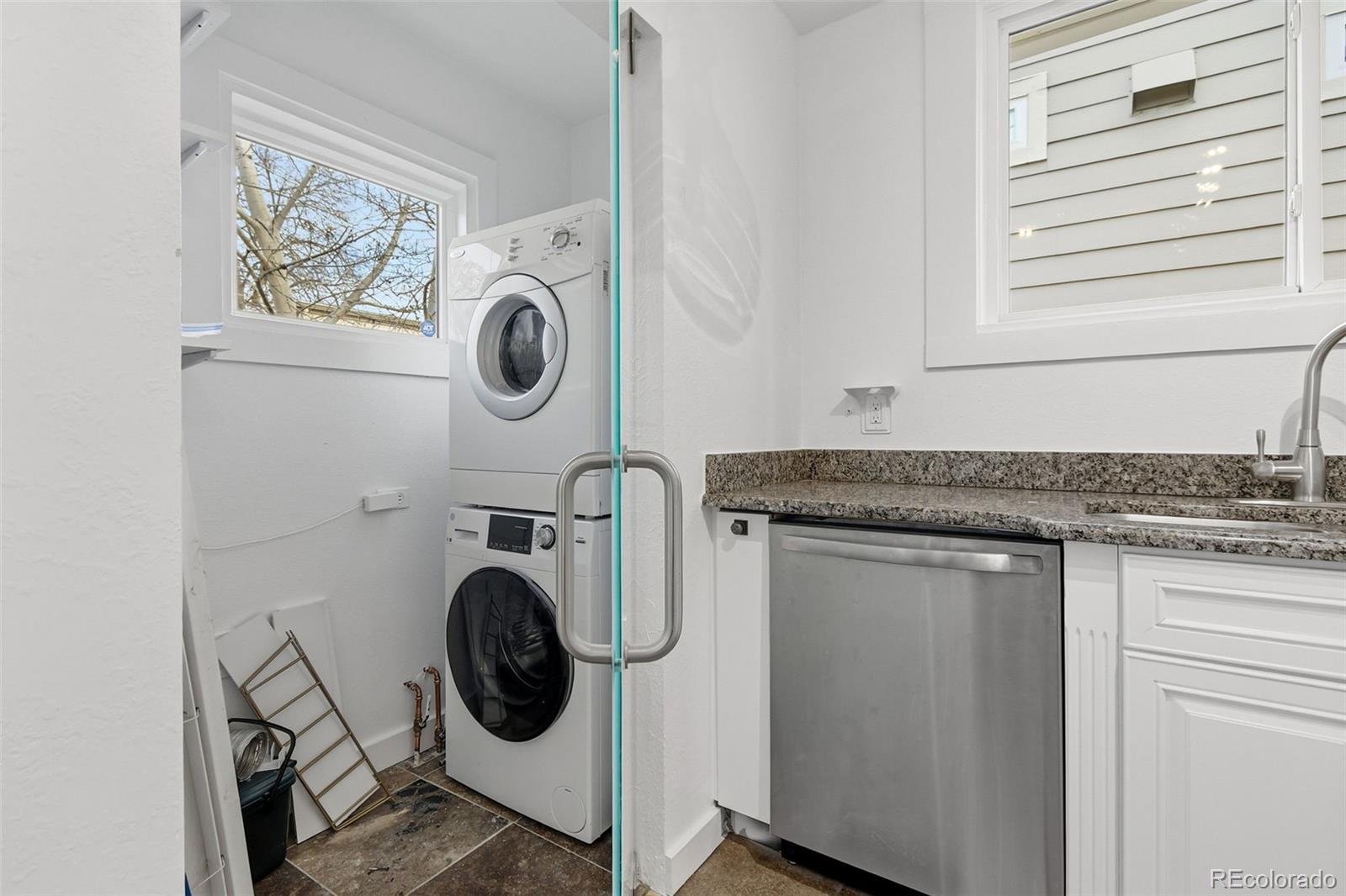 4182 Yates Street Denver, CO 80212 - Photo 22 of 48 a utility room with sink dryer and washer