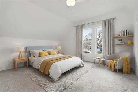 a bedroom with a bed and glass window