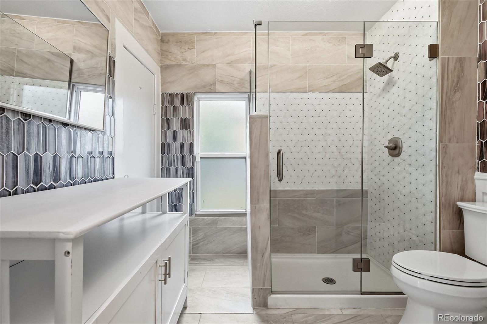 4182 Yates Street Denver, CO 80212 - Photo 28 of 48 a bathroom with a shower and a toilet