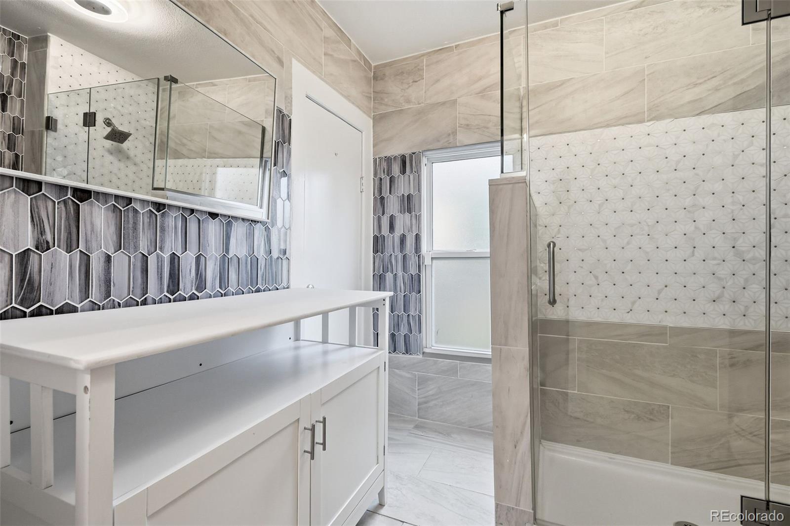 4182 Yates Street Denver, CO 80212 - Photo 29 of 48 a view of bathroom with tub and shower
