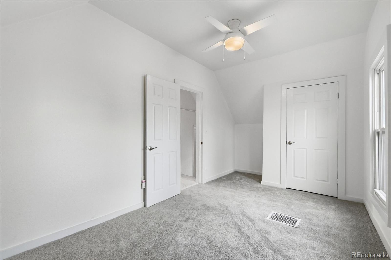 4182 Yates Street Denver, CO 80212 - Photo 33 of 48 an empty room with closet and a ceiling fan