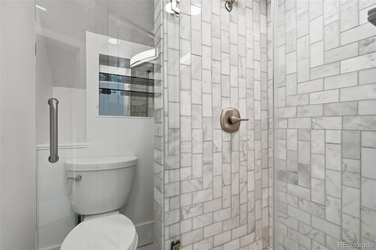 4182 Yates Street Denver, CO 80212 - Photo 36 of 48 a bathroom with a toilet and a shower