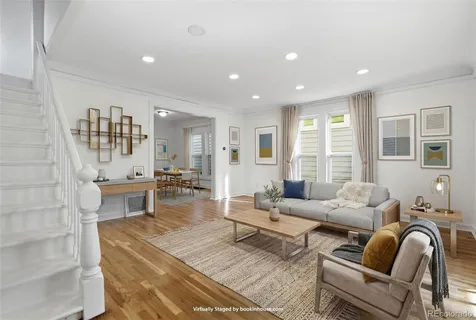 a living room with furniture and a table