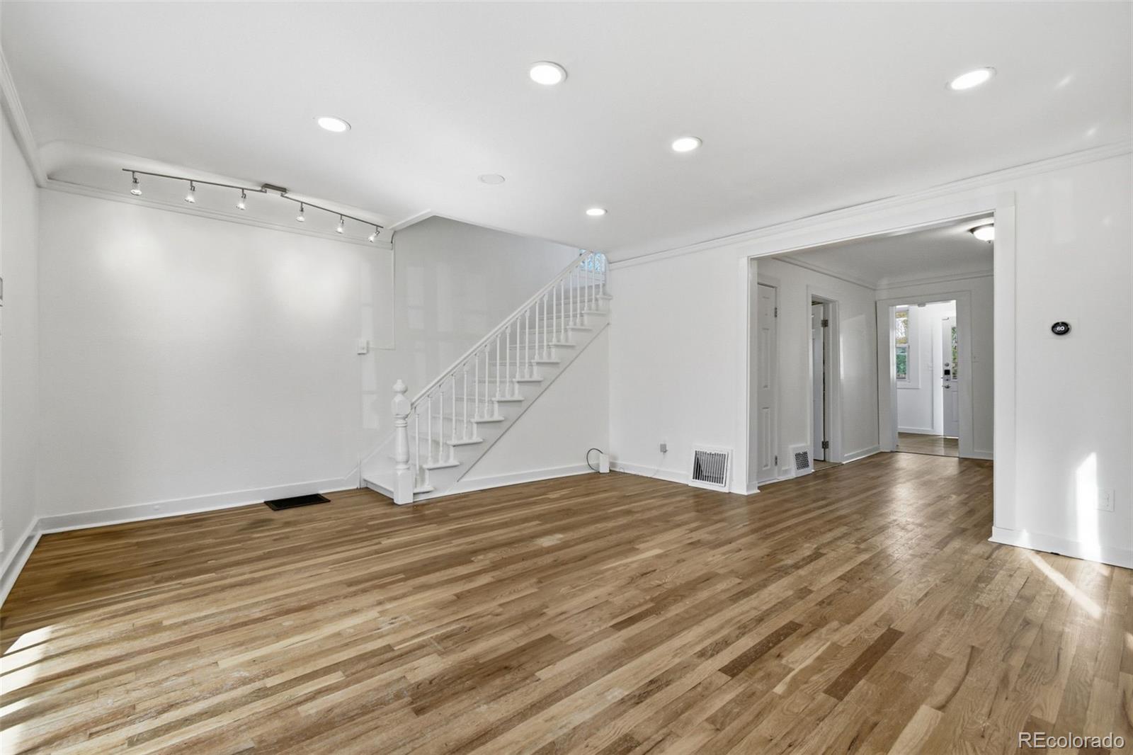 4182 Yates Street Denver, CO 80212 - Photo 9 of 48 a view of an empty room with wooden floor
