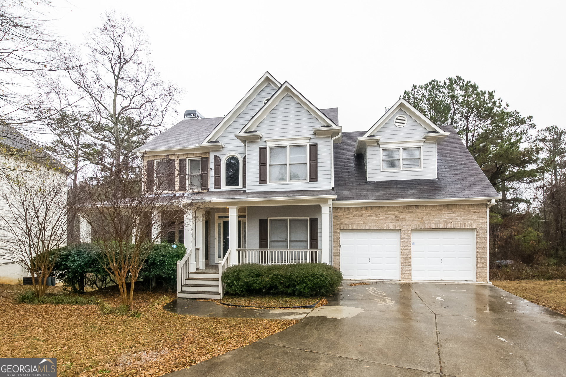 2485 Worthington Drive Powder Springs, GA 30127 - Photo 2 of 15 a front view of a house with a yard and garage