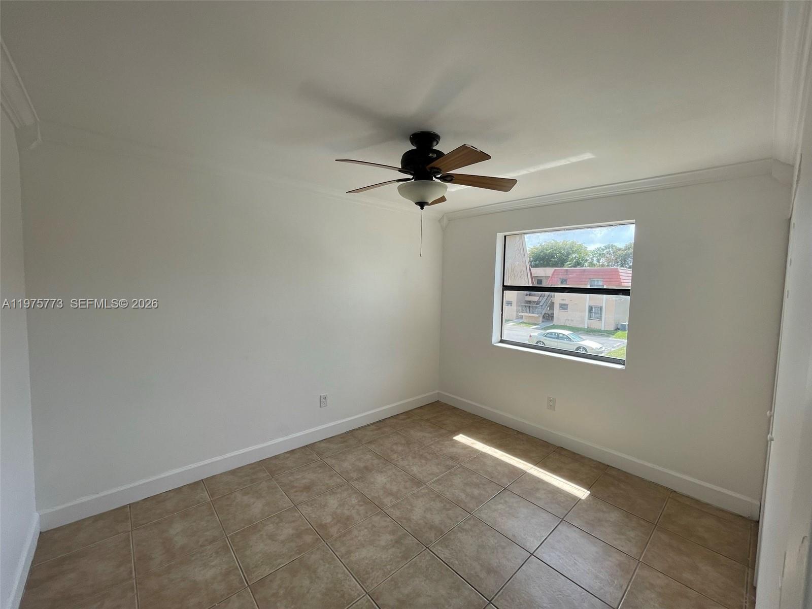 14915 Southwest 104th Street, Unit 2024 Miami, FL 33196 - Photo 14 of 34 a view of an empty room with a window