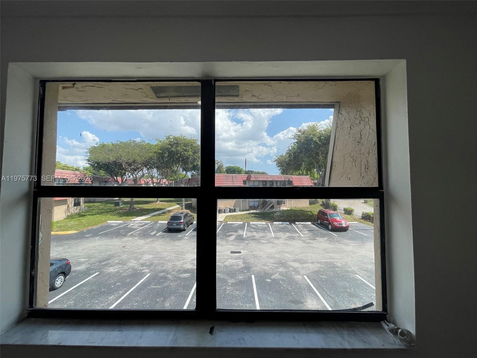 14915 Southwest 104th Street, Unit 2024 Miami, FL 33196 - Photo 17 of 34 a view of a glass door with a glass door