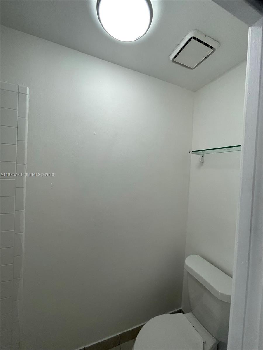 14915 Southwest 104th Street, Unit 2024 Miami, FL 33196 - Photo 20 of 34 a bathroom with a toilet and sink
