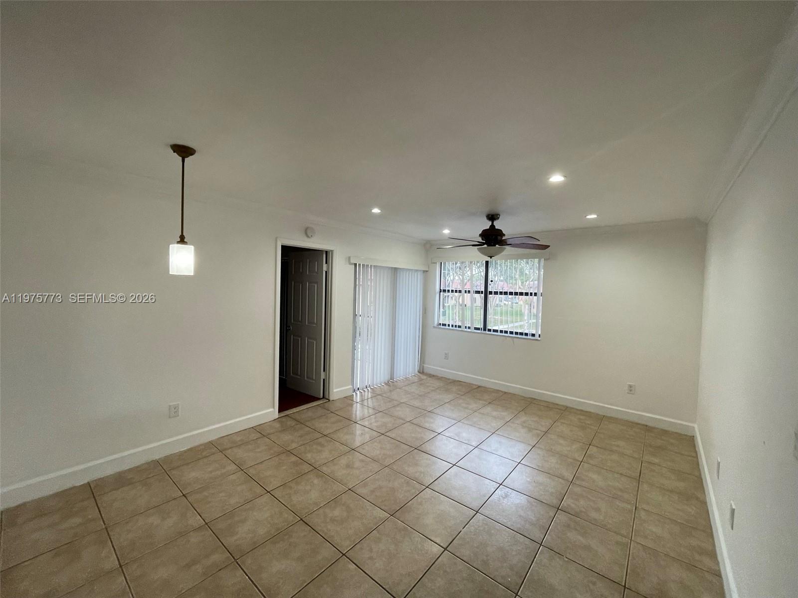 14915 Southwest 104th Street, Unit 2024 Miami, FL 33196 - Photo 22 of 34 a view of a livingroom with a staircase
