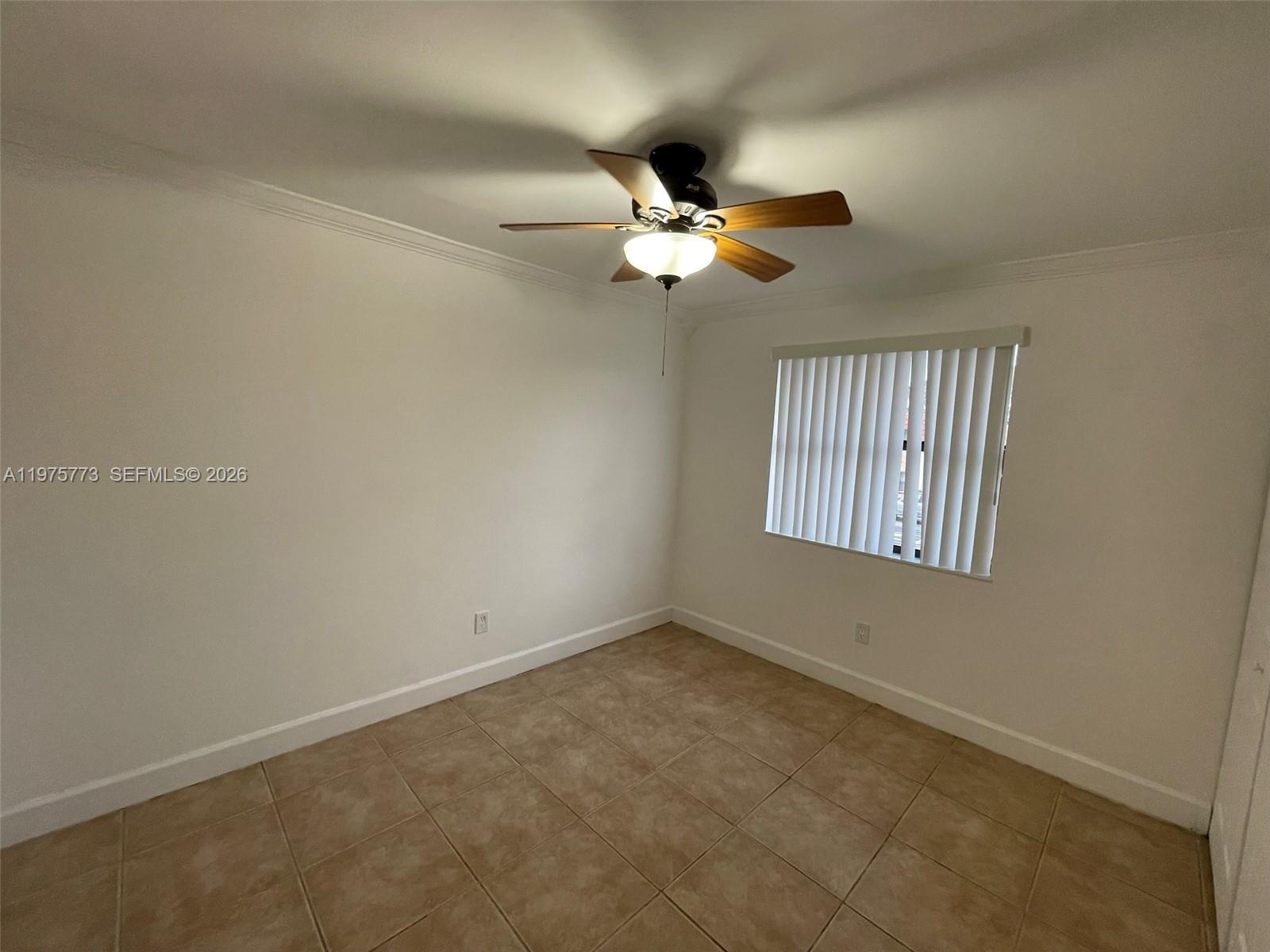 14915 Southwest 104th Street, Unit 2024 Miami, FL 33196 - Photo 23 of 34 en view of an empty room with a window