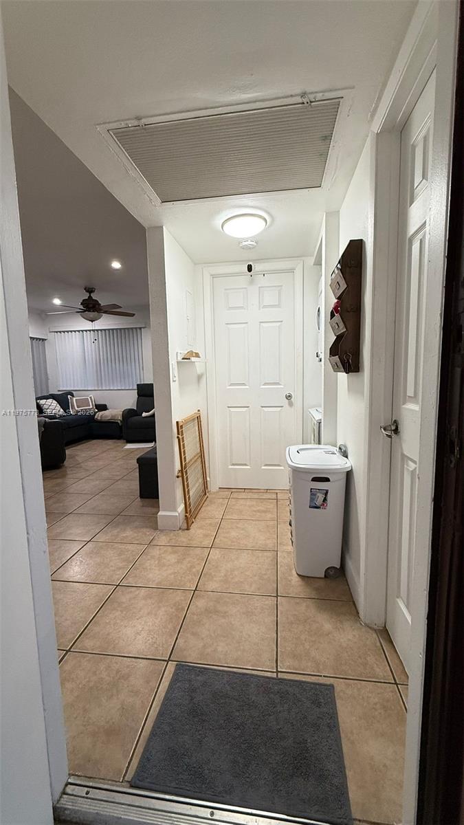 14915 Southwest 104th Street, Unit 2024 Miami, FL 33196 - Photo 26 of 34 a bathroom with a sink and a mirror