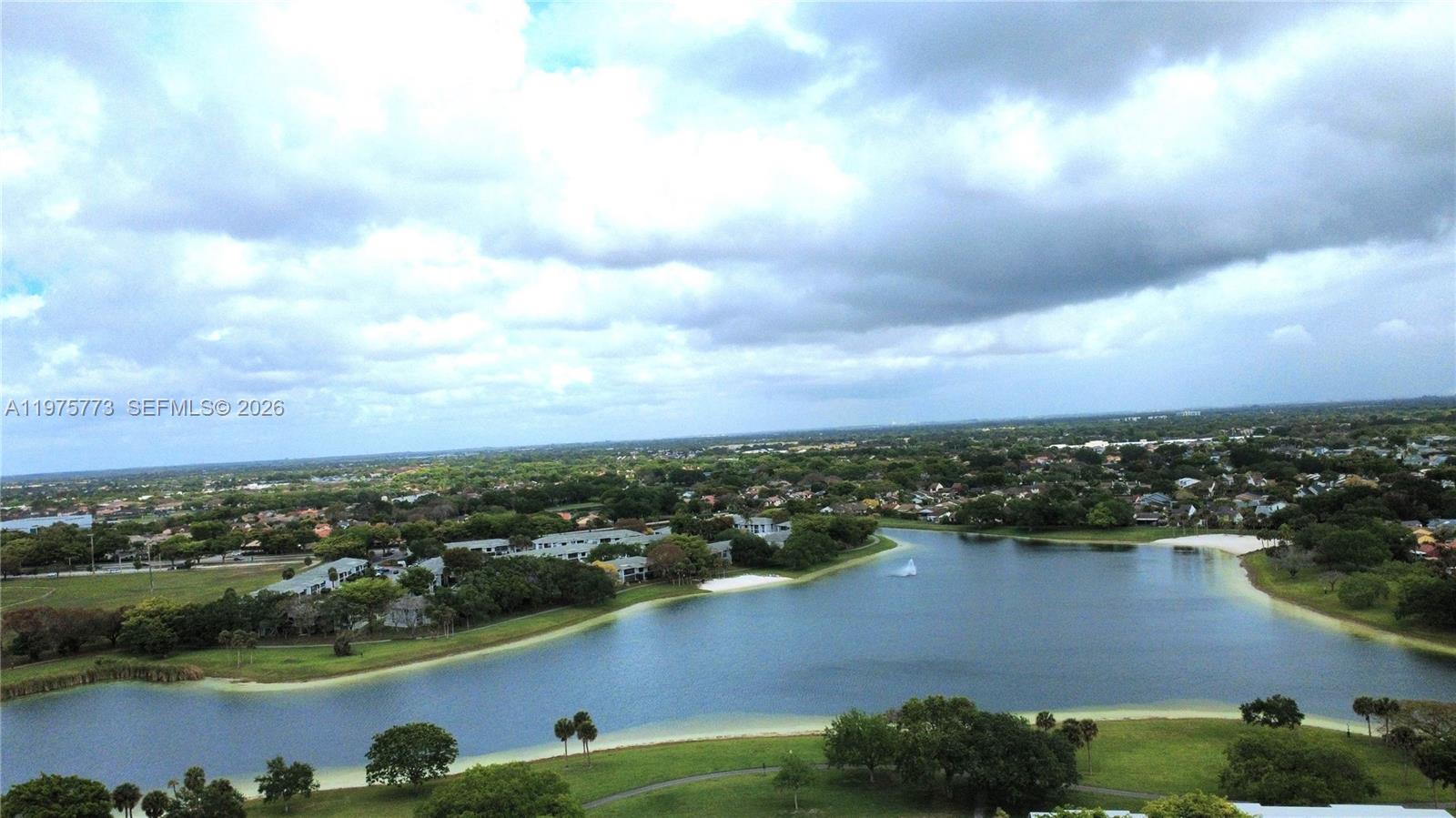 14915 Southwest 104th Street, Unit 2024 Miami, FL 33196 - Photo 27 of 34 an aerial view of a city with lots of residential buildings and lake view in back
