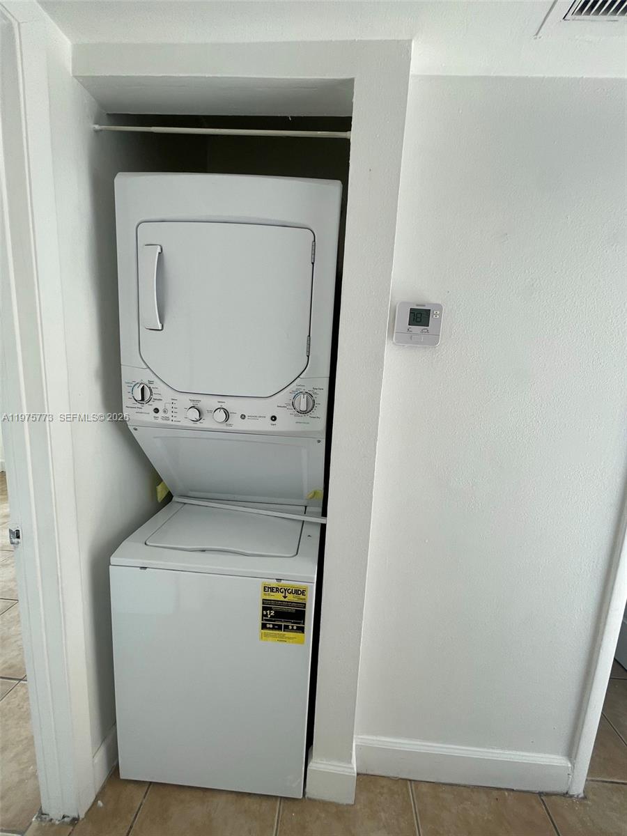 14915 Southwest 104th Street, Unit 2024 Miami, FL 33196 - Photo 9 of 34 a utility room with dryer and washer